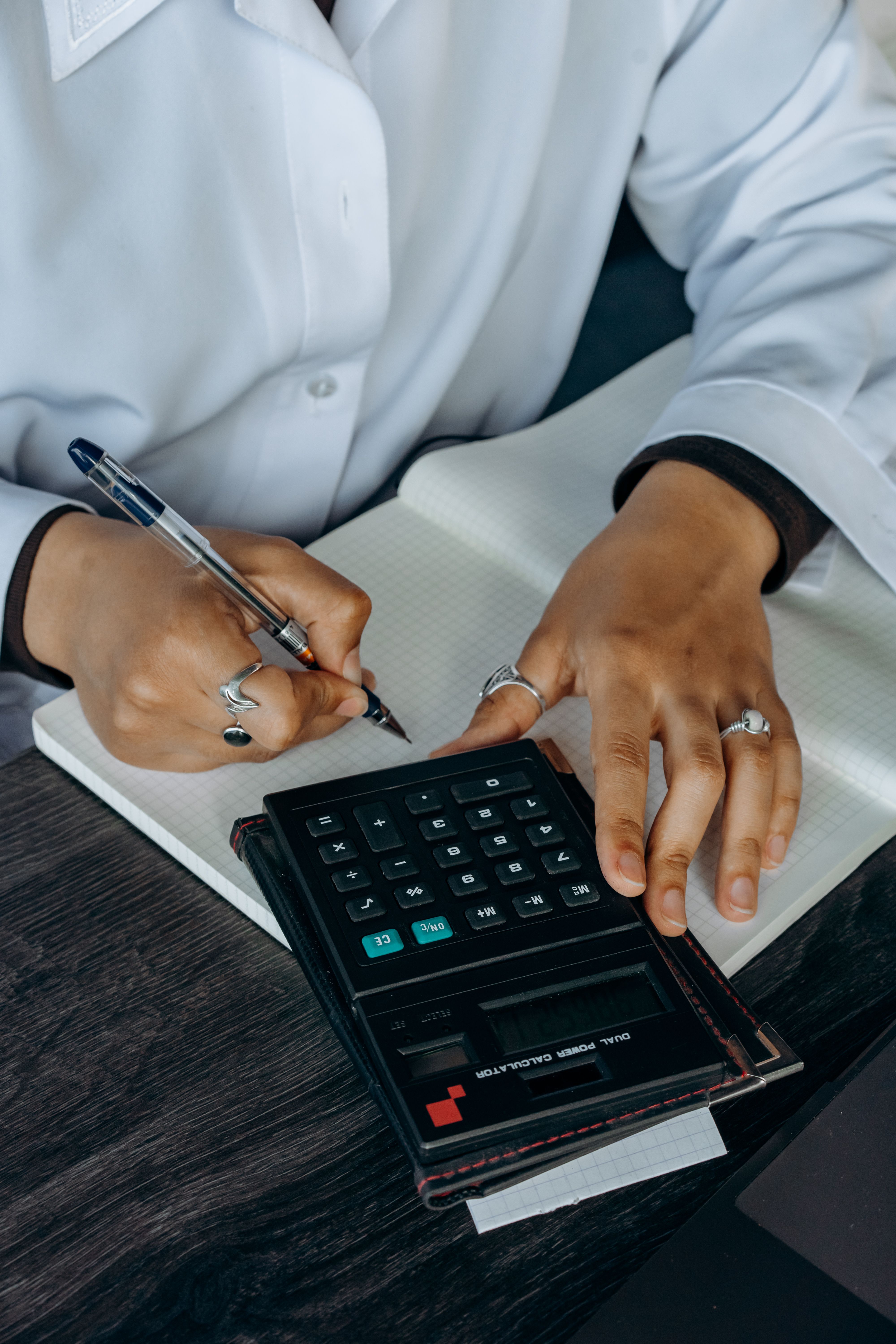 Investment consultant analysing financial data and market research at a desk